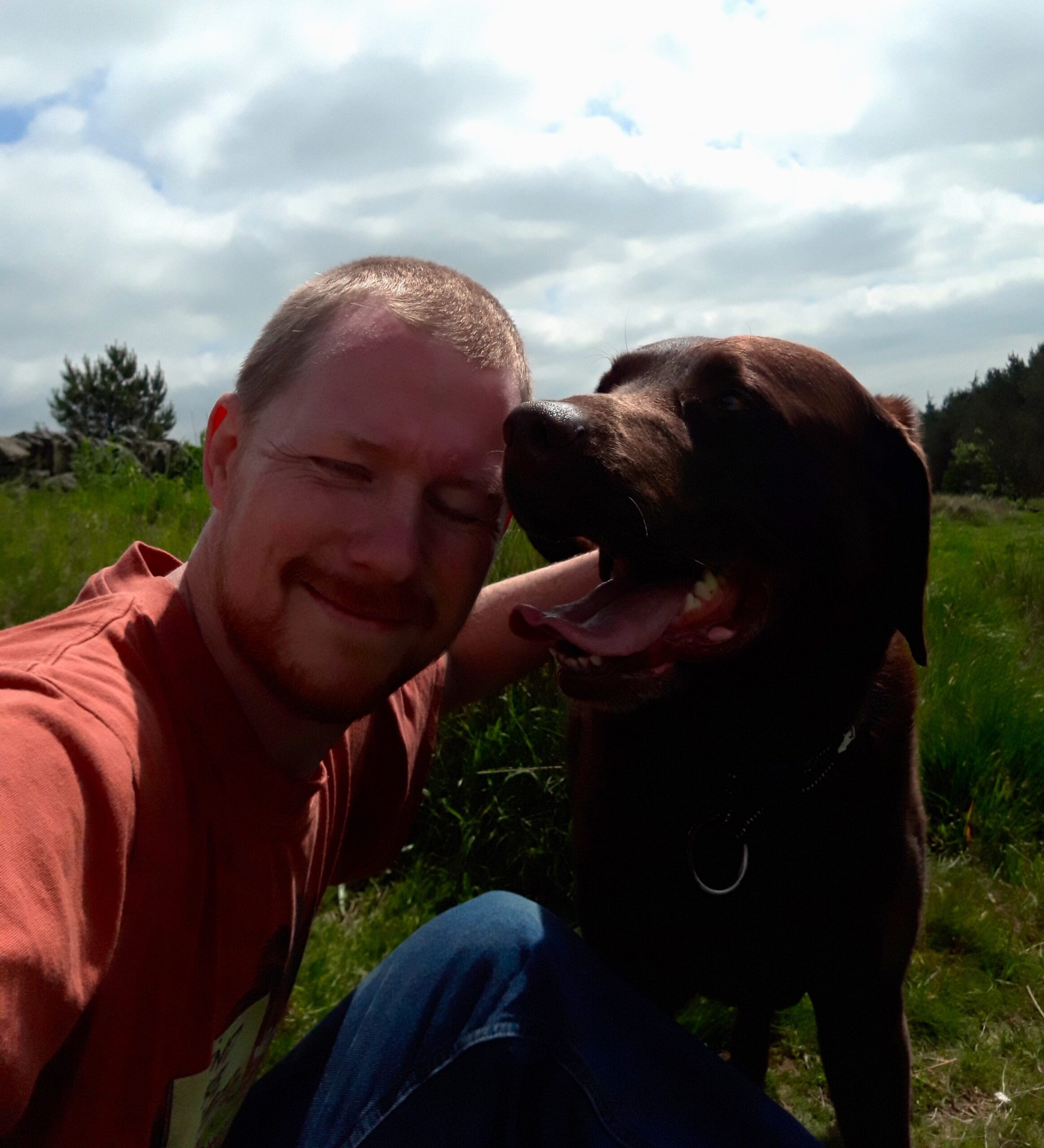 Me and Ringo the dog sharing a selfie in a sunny field
